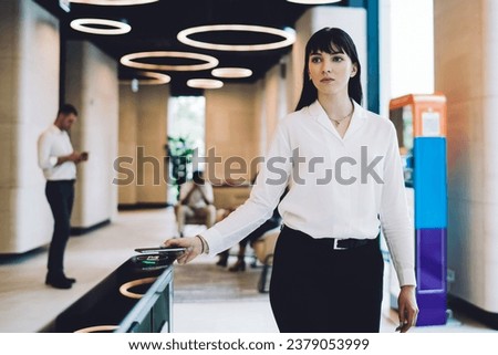 Similar – Image, Stock Photo Stylish businesswoman walking along street in city