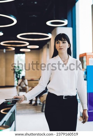 Similar – Image, Stock Photo Stylish businesswoman walking along street in city