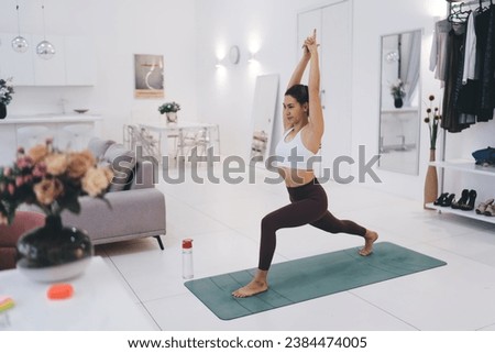 Content woman doing yoga