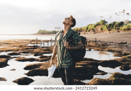 Similar – Image, Stock Photo Man standing on seaside and contemplating moment