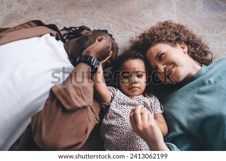 Similar – Image, Stock Photo Crop multiracial couple holding little fingers