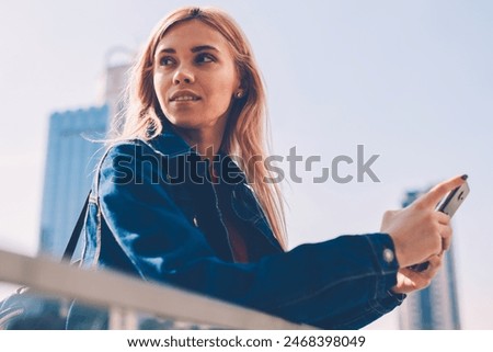 Image, Stock Photo Charming girl in denim jacket in nature