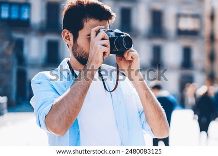 Similar – Image, Stock Photo Male photographer taking picture with camera on street