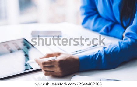 Similar – Image, Stock Photo Anonymous black businesswoman using smartphone at home