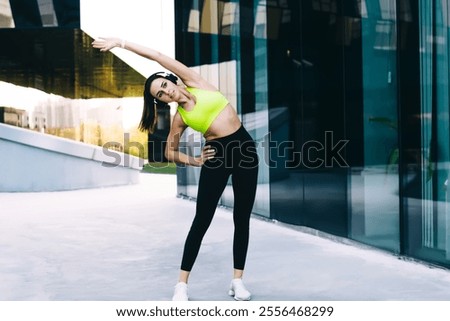 Similar – Image, Stock Photo Slim sportswoman standing near building on street