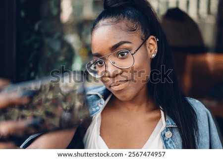 Similar – Image, Stock Photo Glad woman sitting near building wall in city