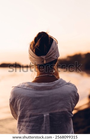 Similar – Image, Stock Photo Unrecognizable female traveler enjoying sunny day on rocky seashore