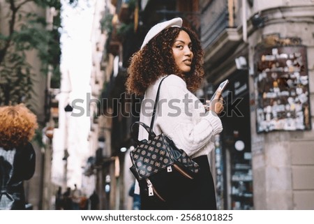 Similar – Image, Stock Photo Thoughtful young female tourist standing on rocky seashore and looking away