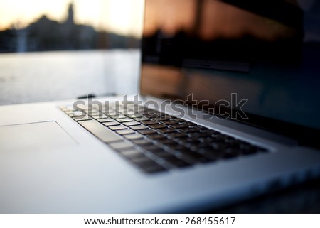 Closeup shot open laptop computer with macro keyboard and beautiful outdoors day light reflection, ready to start new project, began to create Zdjęcia stock © 