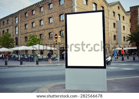 Blank billboard with copy space for your text message or content, public information board in the big town, advertising mock up empty banner in metropolitan city at beautiful sunny day