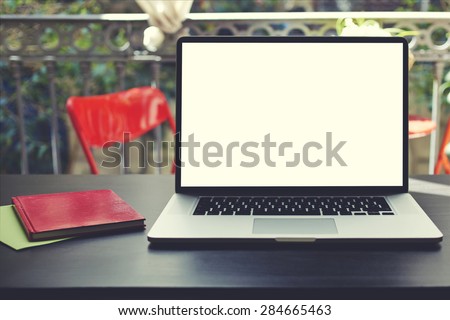 Laptop computer with blank copy space screen for your information or content, on-line learning or distance work concept,freelance workplace with empty display notebook on modern table in home interior