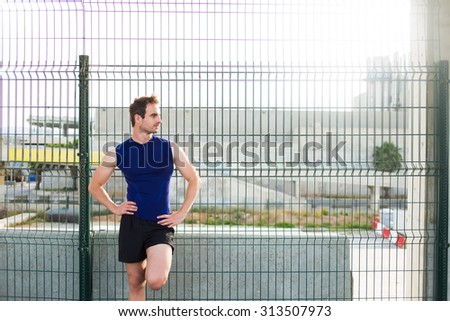 Half length portrait of handsome man with athletic body rest after workout exercise outdoors, young male runner taking break with copy space area for your text message or advertising content