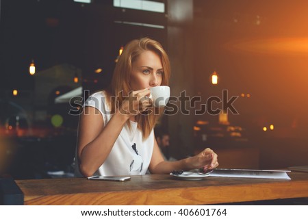 Image, Stock Photo Dreamy young lady drinking hot beverage near window with adorable weiro bird on shoulder