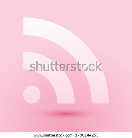 Paper cut RSS icon isolated on pink background. Radio signal. RSS feed symbol. Paper art style. Vector