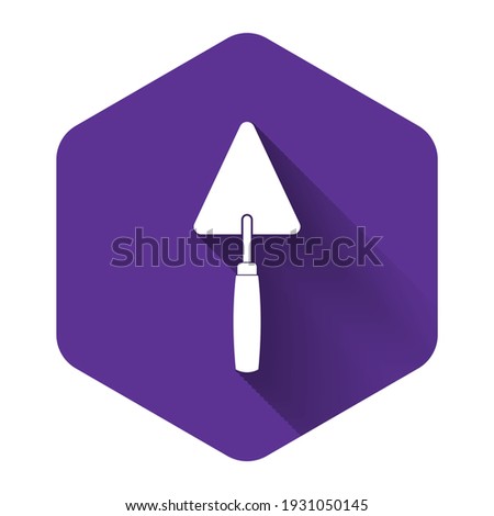 White Trowel icon isolated with long shadow. Purple hexagon button. Vector Illustration