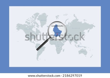 Map of Luxembourg on political world map with magnifying glass