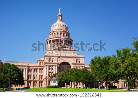 AUSTIN, TEXAS - SEPTEMBER 14: The Texas state capitol with the statue of  Terry\'s Texas Ranger on September 14, 2011 in Austin, USA.
