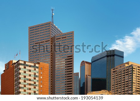 DALLAS, TEXAS - SEPTEMBER 13, 2011: Photo showing Dallas city scape with Comerica bank tower in the center and the 15-story building at 511 N. Akarda on the left  in the late afternoon sunlight.
