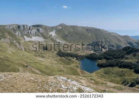 Similar – Image, Stock Photo 1600 | Mountain lake with clouds hanging low in the mountain