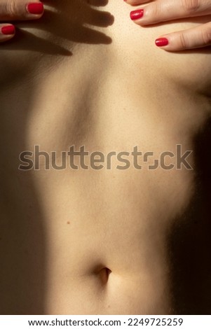 Similar – Image, Stock Photo Close-up of the belly of a woman who is lying sunbathing in a bikini