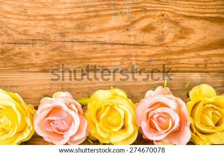 Colorful roses flowers, flowers background on a vintage wooden planks background for mothers day, wedding invitation, greetings card and invitation cards