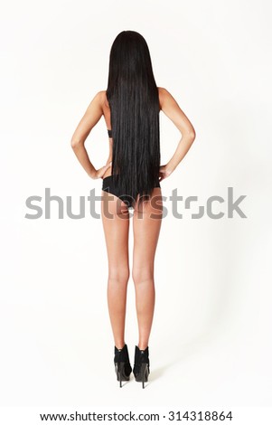 Beautiful sexy asian woman with long hair.  Back view. Studio shot