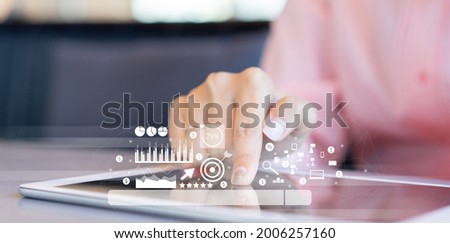 close up businesswoman hand touch screen on digital tablet to use marketing tool and check traffic research of pay per click program on web page for online b2b business and lifestyle concept Zdjęcia stock © 
