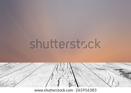 old vintage wooden desk table with blurred twilight sky backgrounds