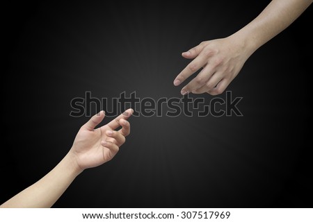 helping hand and hands praying isolated on black background , helping hand concept.