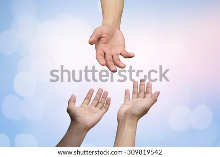 helping hand and hands praying on blurred colorful background with bokeh light , helping hand concept.