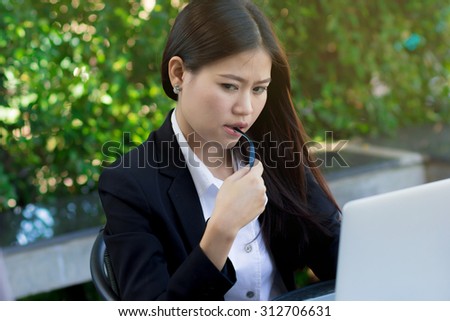 close up asian business woman feeling serious with her job at outside office : working woman thoughtful and stress, business woman concept,working depression concept.