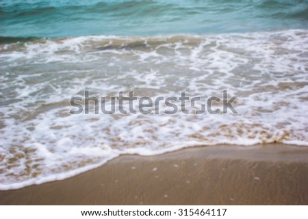 Abstract blurred of sea and beach backgrounds : blur of sea on summer vacation relaxing : blur of wave on the beach : blur backgrounds concept.summer concept.vacation time concept.relaxing concept.