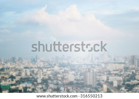 Blurred industrial city backgrounds : blur of Bangkok city town with sunset and twilight sky and bokeh light view form roof top of building . blur backgrounds concept