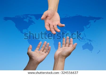 helping hand and hands praying over blur map of the world on blurred blue sky backgrounds. helping hand concept.international assistance concept.business concept.peaceful concept.help economics crisis