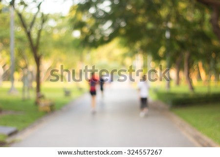 blurred backgrounds of people exercise at parks outdoor:blur of people running,walking,jogging at park:blur of nature park outdoor:blur and out of focus concept:blurred of sport and activity concept.