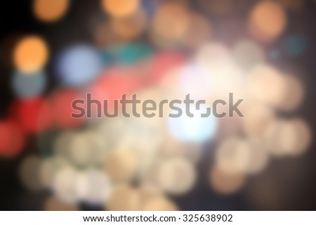 Blurred night city background with circle light. blur backgrounds concept.pastel tone.blur of bokeh circle light christmas festive backdrop concept.