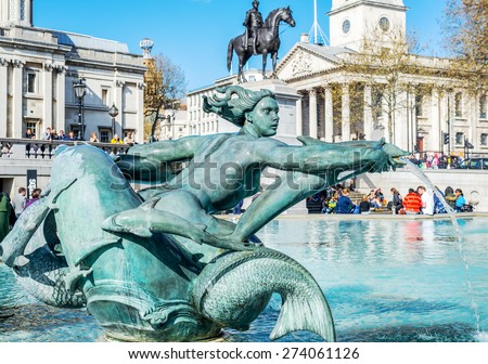 LONDON - APR 11:Tourists visit Trafalgar Square April 11, 2015 in London. One of the most popular tourist attraction on Earth it has more than fifteen million visitors a year