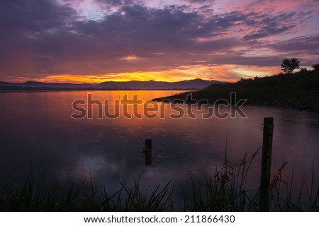 reservoir over sunset and Silhouettes landscape view sunset Water reflection