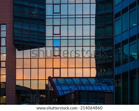 Reflection in a glass facade of a skyscraper in Frankfurt, Germany. Office building in Frankfurt, Germany
