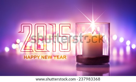 Romantic night with candlelight and bokeh background.Happy new year 2015