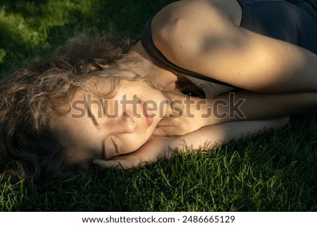 Similar – Image, Stock Photo Teenage girl lying in a blue armchair