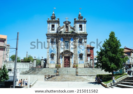 PORTO, PORTUGAL - AUGUST 6: Church of Saint Ildefonso on August 6th, 2014 in Porto, Portugal. Traditional azulejo tiles cover the facade of the church depicting scenes from the life of St. Ildefonso.