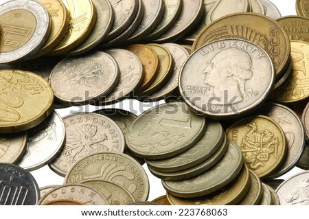 a large number of small metal money photographed close-up