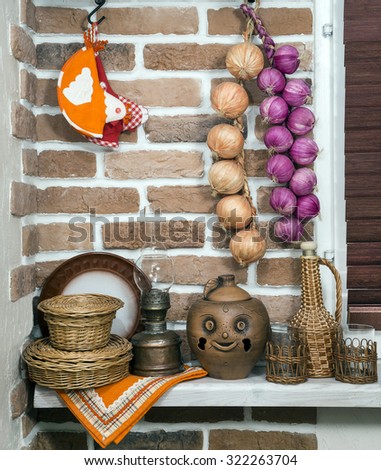 old utensils of clay, in the interior, on the brick wall background. still life