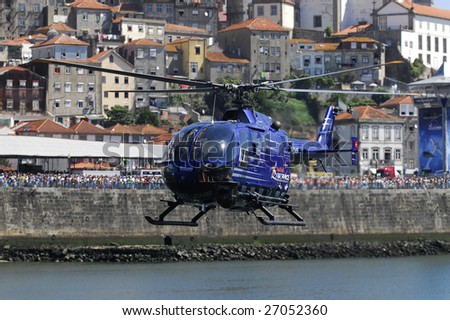 PORTO, PORTUGAL - SEPTEMBER 7 : Team Red Bull Air Race helicopter participates in the Red Bull Air Race on September 7, 2008 in Porto, Portugal.
