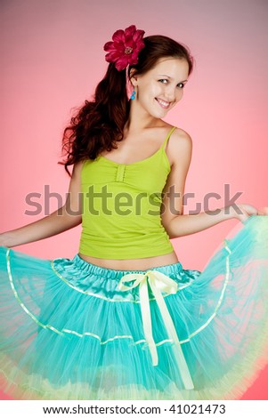 Beautiful young  woman in pink background.