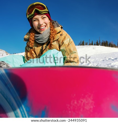 Winter sport, snowboarding - portrait of young snowboarder girl