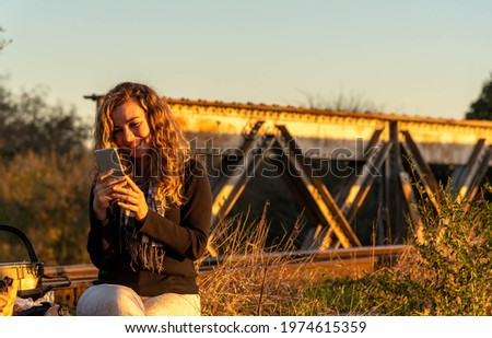 Similar – Image, Stock Photo Train on bridge amid lush plants in mountains