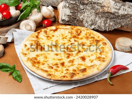 Similar – Foto Bild Pizza mit vier Käsesorten auf dem klassischen blauen Tisch. Pizzascheibe flachgelegt