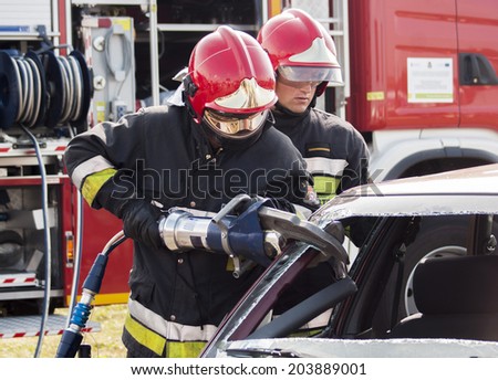 SZCZECIN, POLAND - JULY 08, 2014:Fire and Rescue Emergency Units in action, at car accident.